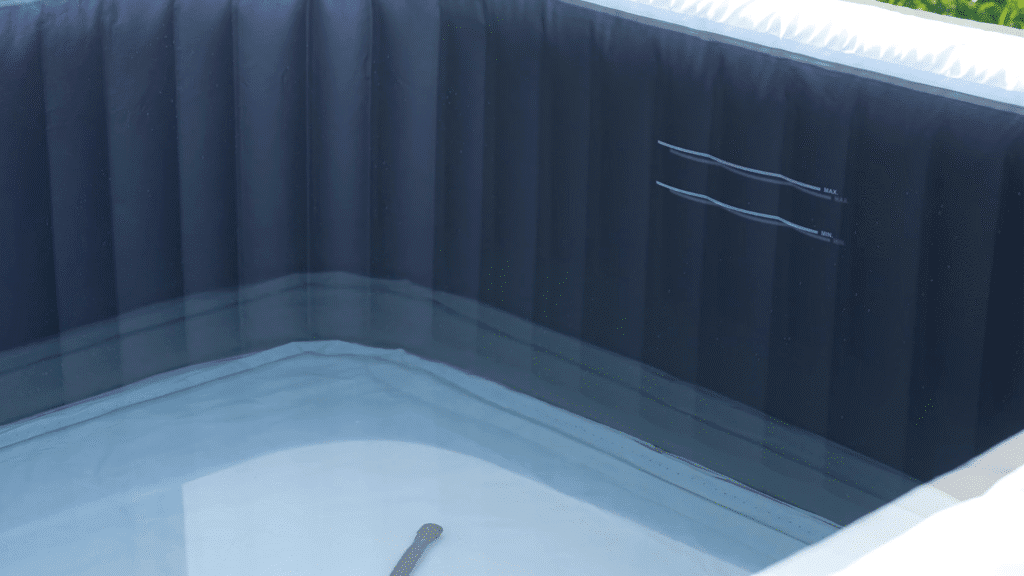 Inflatable hot tub interior with water